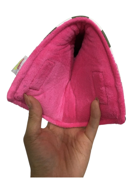 Pink pet bed held by a hand on a white background
