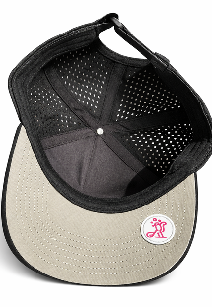 Inside view of Birdies & Bubbles women's black performance golf hat showing breathable perforated fabric panels, structured crown, and adjustable strap closure
