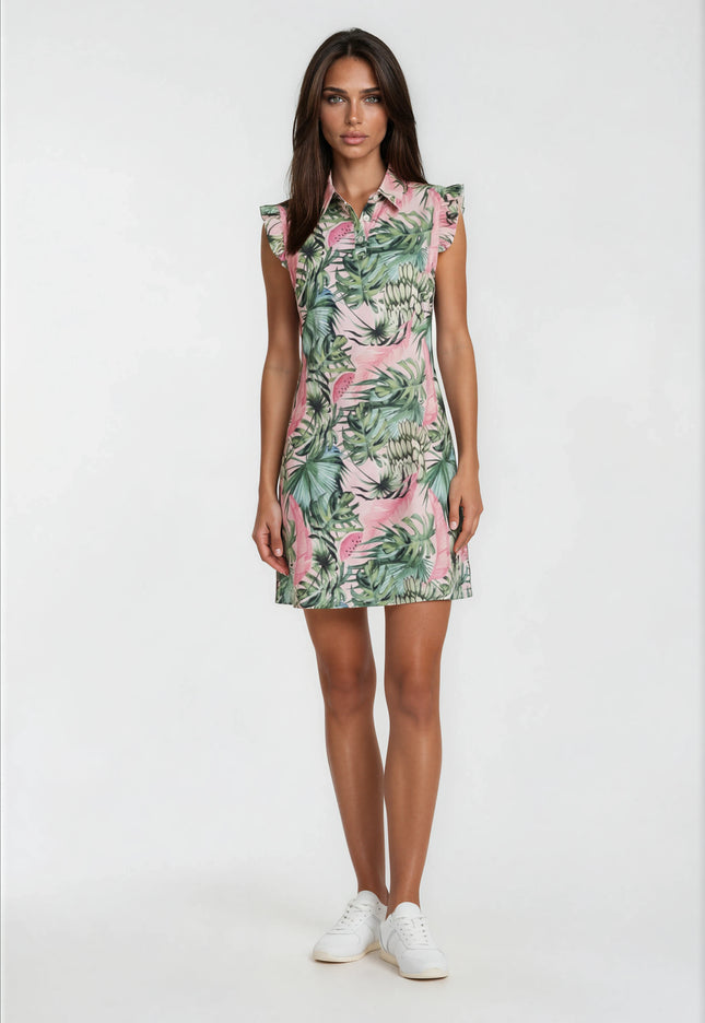 Female model wearing a pink watermelon print golf dress with green tropical leaves and ruffle sleeves