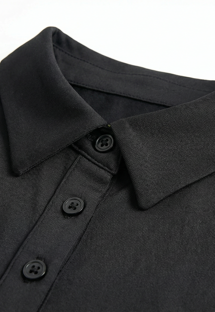 Close-up of a black polo shirt collar with buttons on a white background