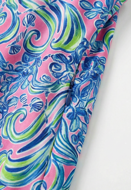 fairway-favorite-womens-golf-dress zoomed in to show the zipper pockets and floral print